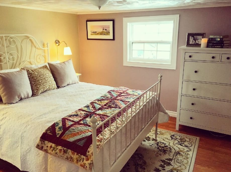 Inside the master bedroom you'll find a queen sized bed with high quality linens. At the foot of the bed is a beautiful homemade quilt.