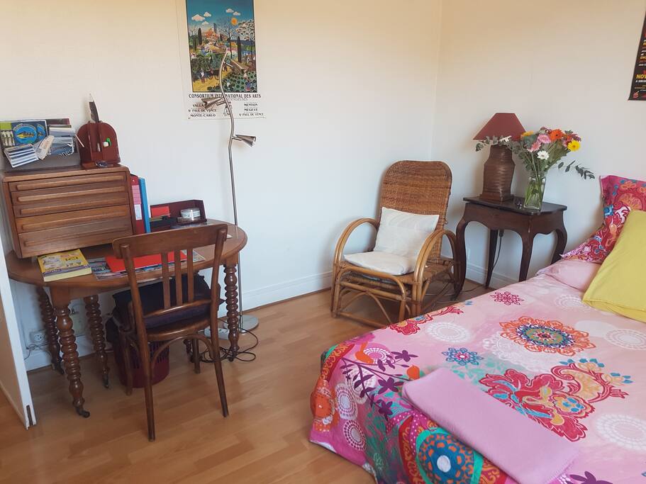 Another view of the bed and desk