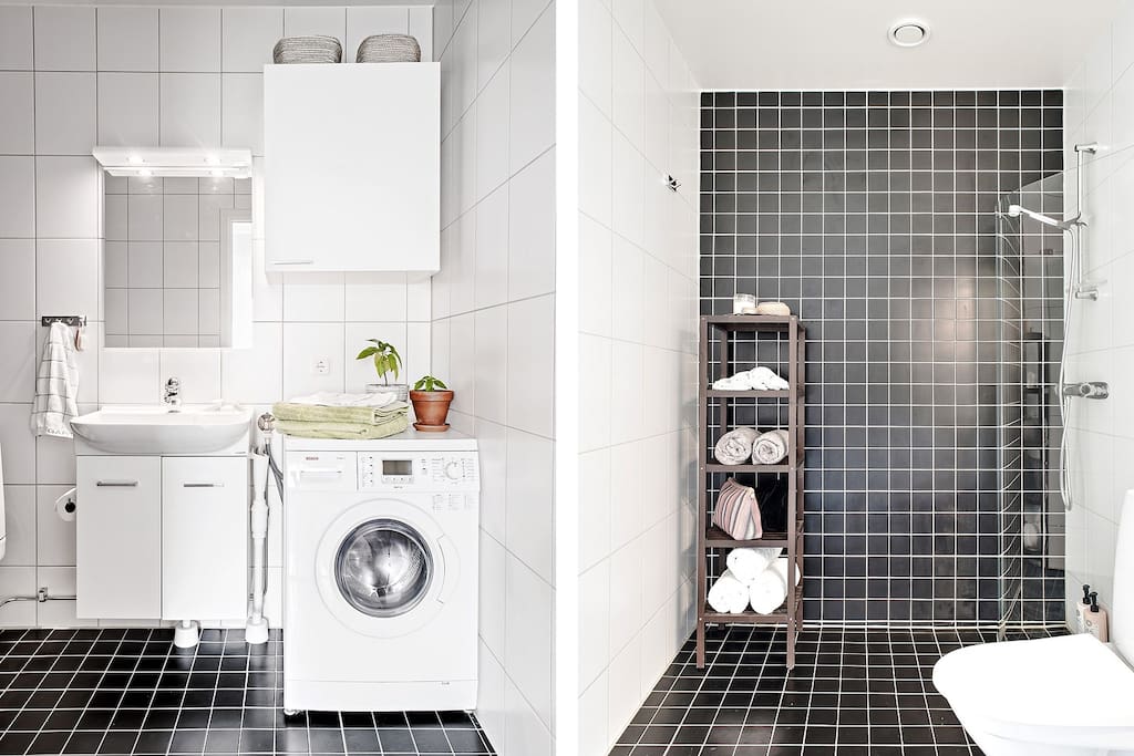Bathroom with shower and combined washer and dryer