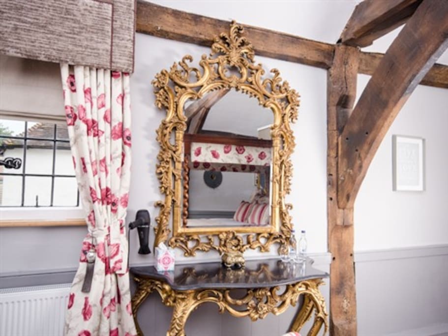 Get ready at the beautiful antique dressing table.