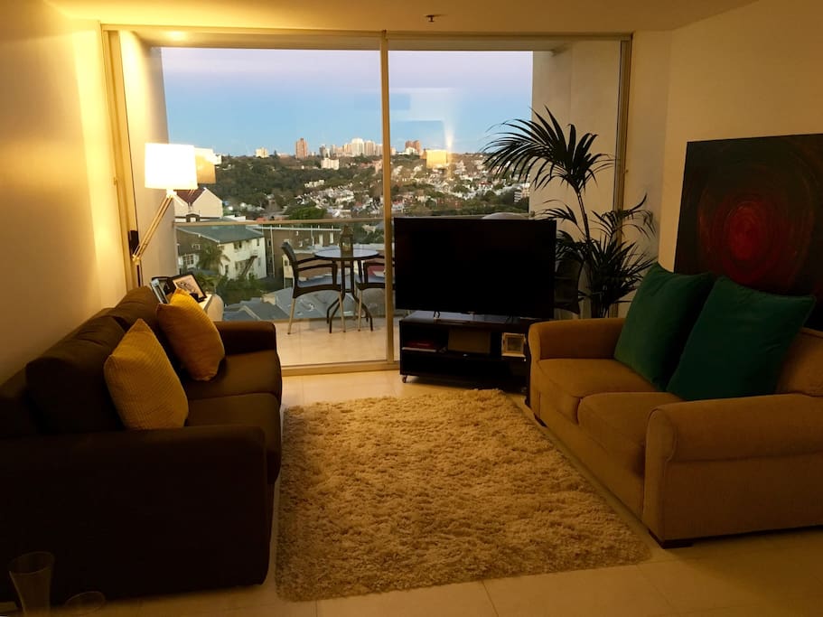 Lounge with comfortable Queen size sofa bed, 50" TV, 2 seater sofa and big balcony.