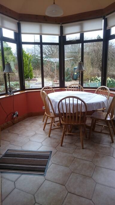 Light filled dining area, with bright sunshine all day.