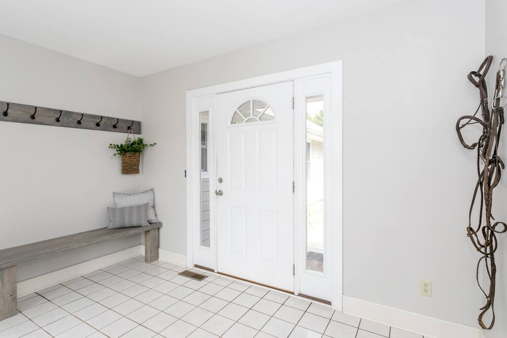 This is the front door where guests will enter. They're greeted with the warm entrance, equestrian decor and fresh chocolates.