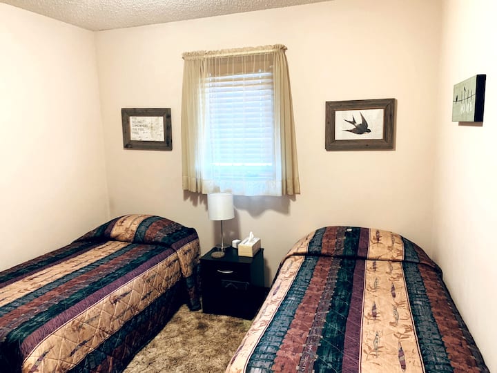 Upstairs bedroom 2 twin beds with full body mirror and large closet.