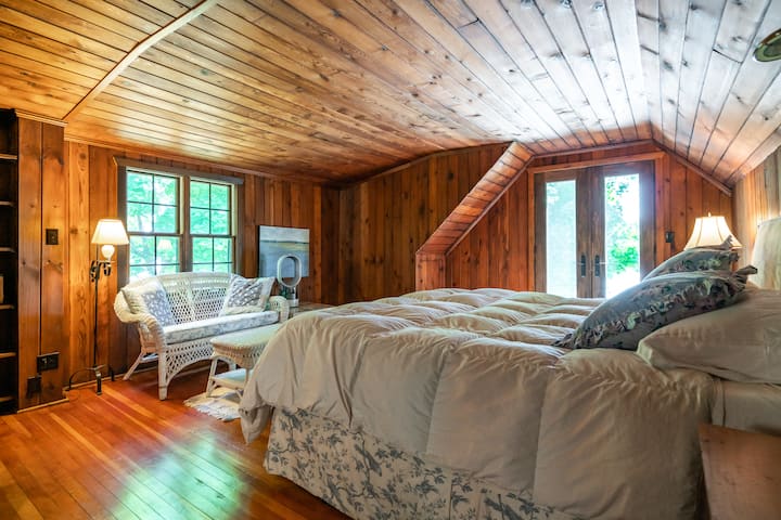 Primary Bedroom with King Size bed and view of the lake