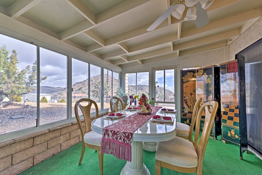 Gaze out at the scenic mountain views from the screened porch.