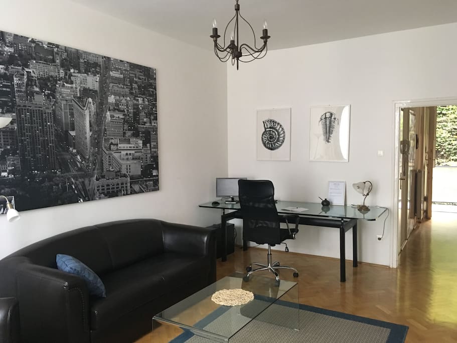 Livingroom with sofa and glass desk