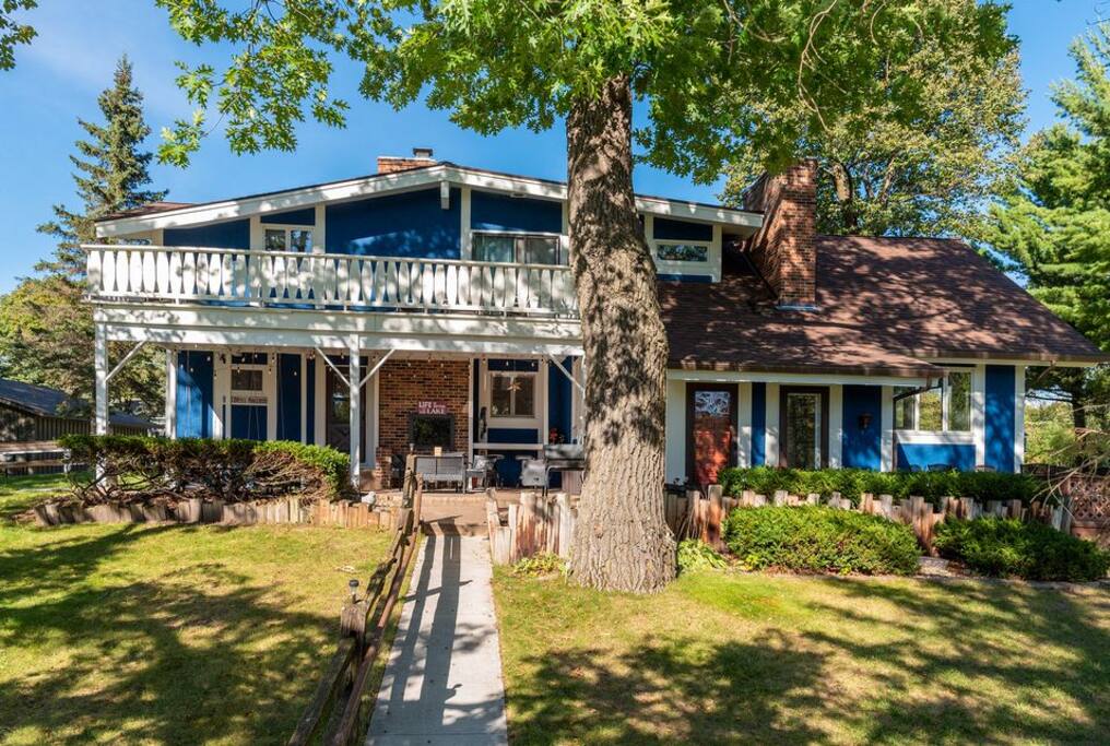 Enjoy THREE Outdoor Spaces!
1. Lower covered patio w/outdoor fireplace
2. Upper white deck
3. Lower level lake front brown deck