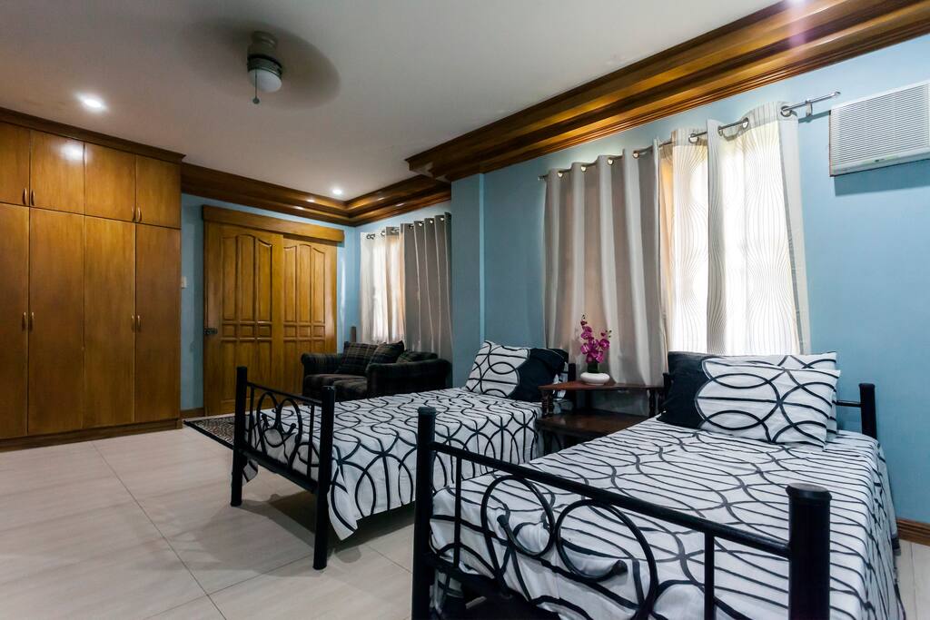 Spacious bedroom with television set and wifi.