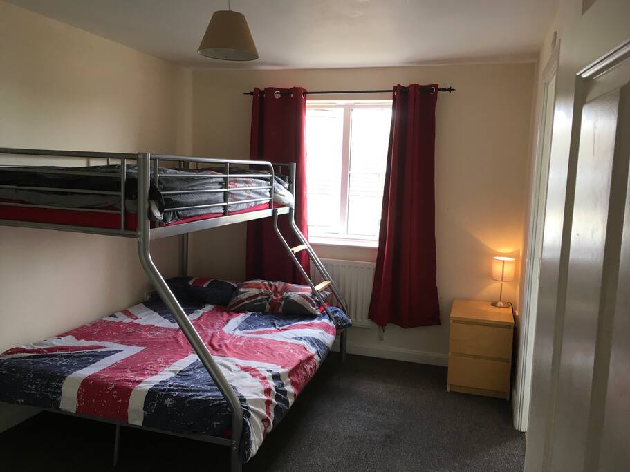 Triple bunk sleeper room with fitted wardrobes