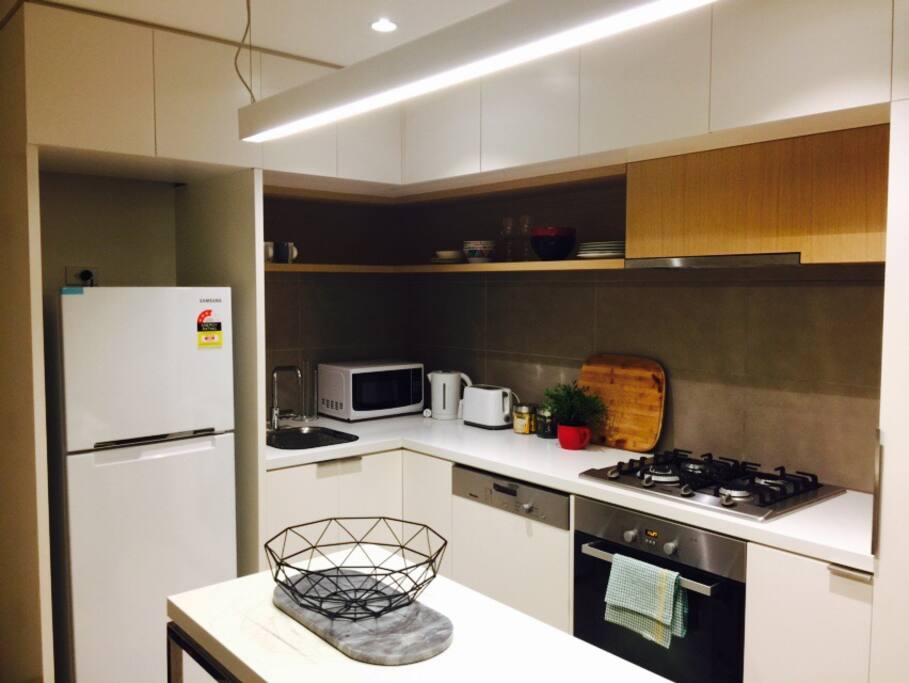 Brand new fridge, microwave and toaster in kitchen. Stunning modern kitchen with gas cooktops and oven.