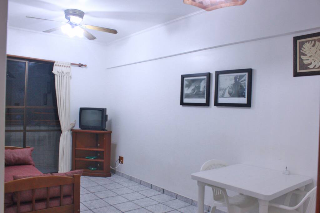Sala com sofá bicama