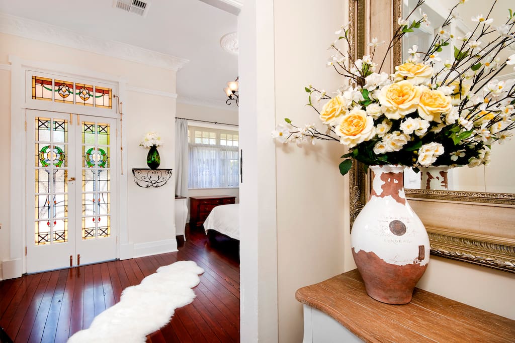 Hall table and large mirrors enhance the space entry foyer.