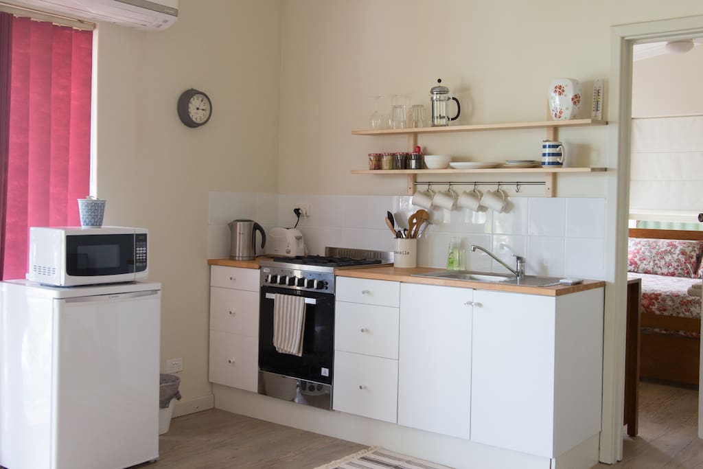 A simple well equipped kitchen area.