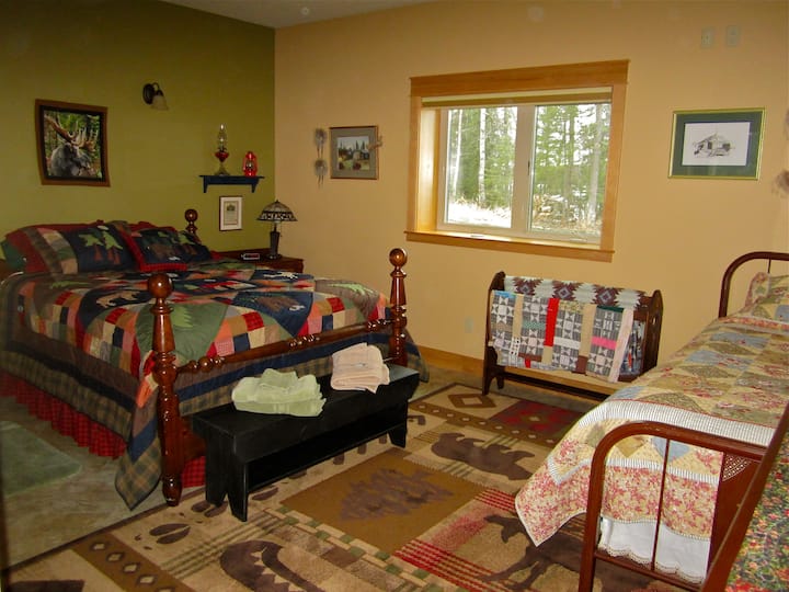 Master Bedroom Room 1 has a queen bed and a twin bed.