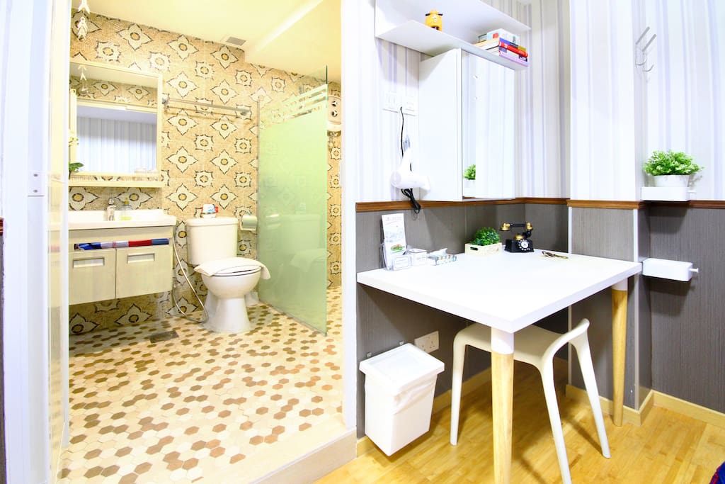 Clean & modern toilet with basic toiletries and towels provided