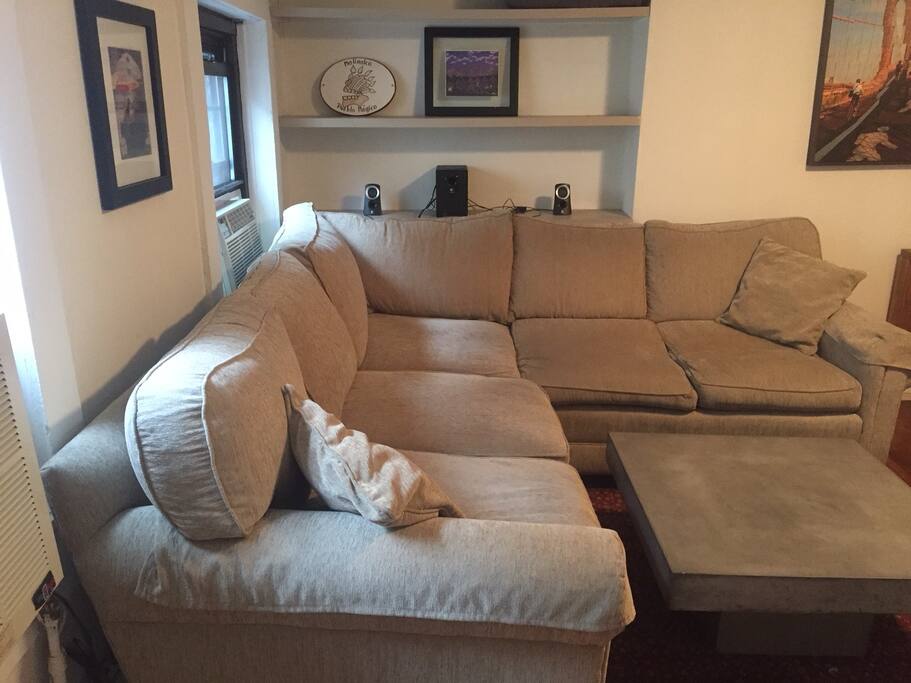 Relax in the living room with speakers and a 42" wall mounted TV with cable