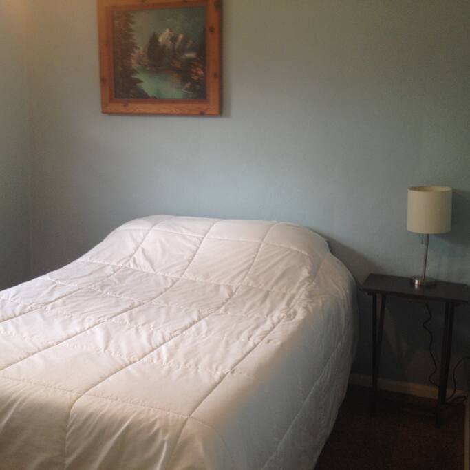 Full size bed with new memory foam topped mattress.