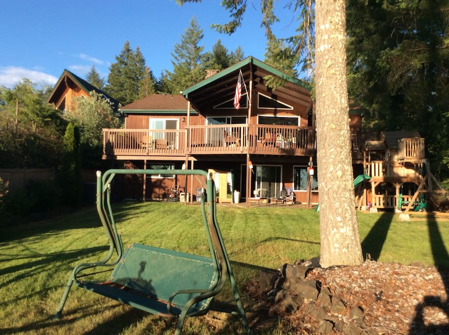 The back side of this 2 level Chalet Cedar home.