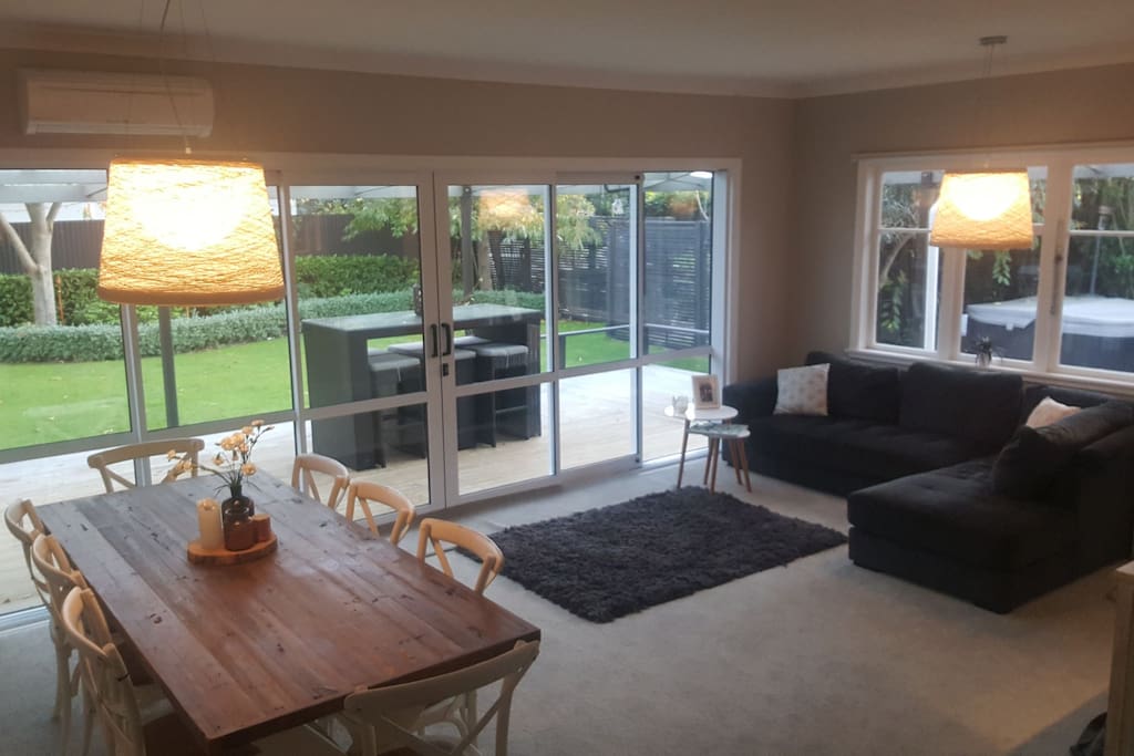 Dinning and casual lounge and heat pump.
5 mtr opening stacker doors on to deck and Bbq area.