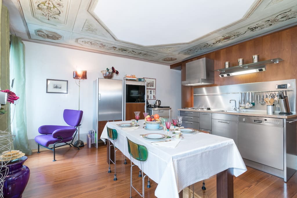 Fully equipped kitchen with Tiepolo's school frescoes on the ceiling.