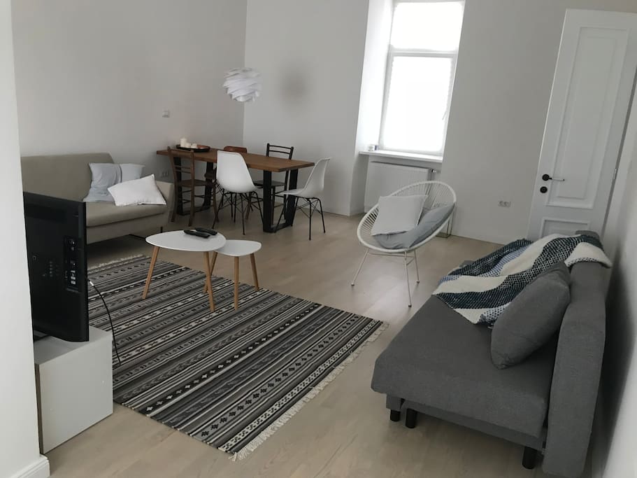 The sofa on the right is turned into a sleeping place for two