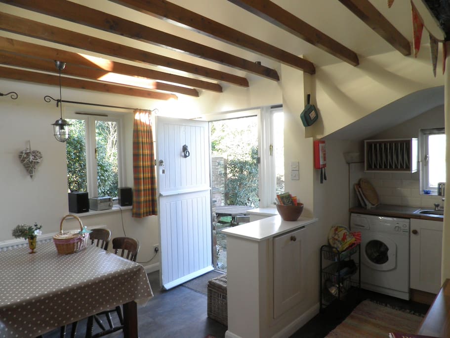 Compact kitchen, dining room, with views to private garden.