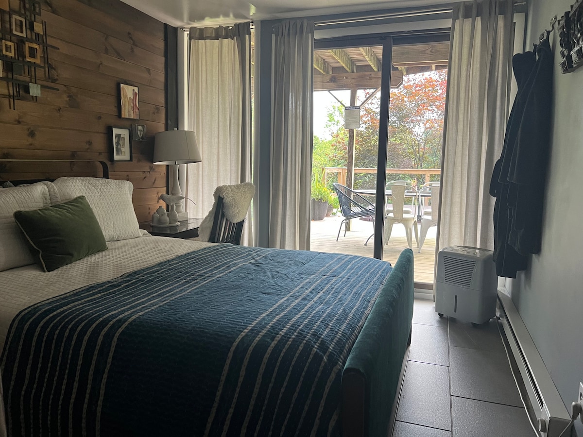 Bedroom 2 with sliding door to lower deck and hot tub