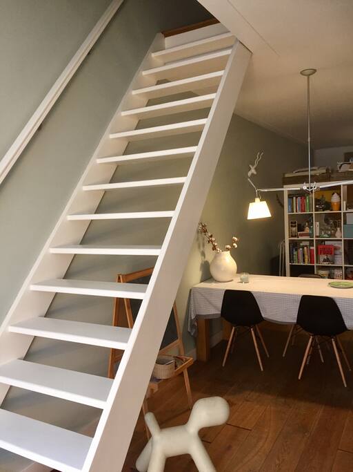 dining table and stairs to second floor