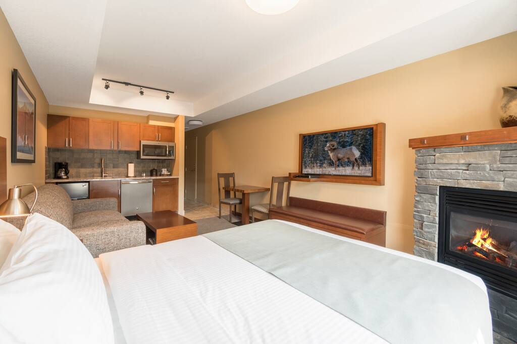 Relax and watch TV in bed after a fun day on the town.
