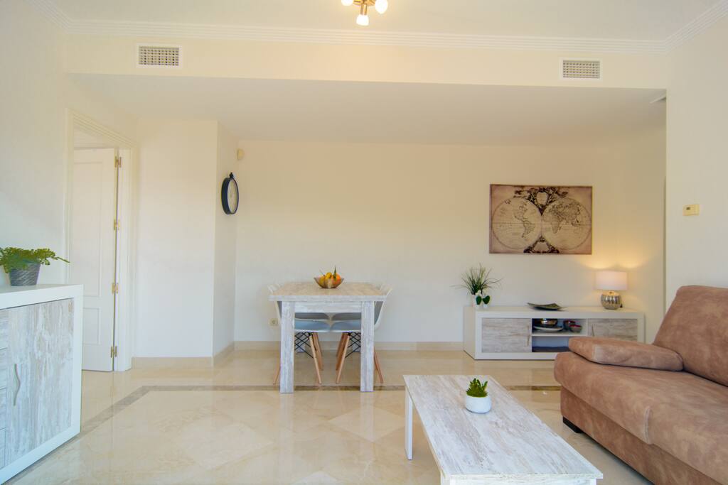 Dining area with wooden table for four guests