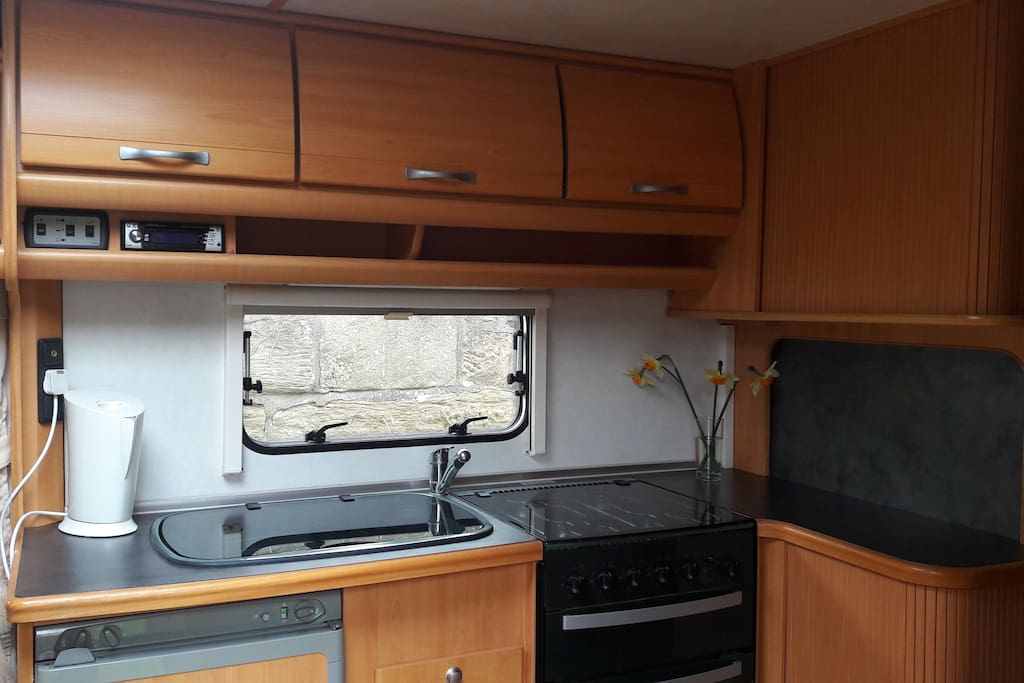 fully equipped kitchen including fridge-freezer, 4-burner hob and oven