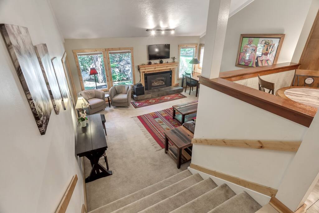 Living room steps down from kitchen level - note extendable table for dining space for six people