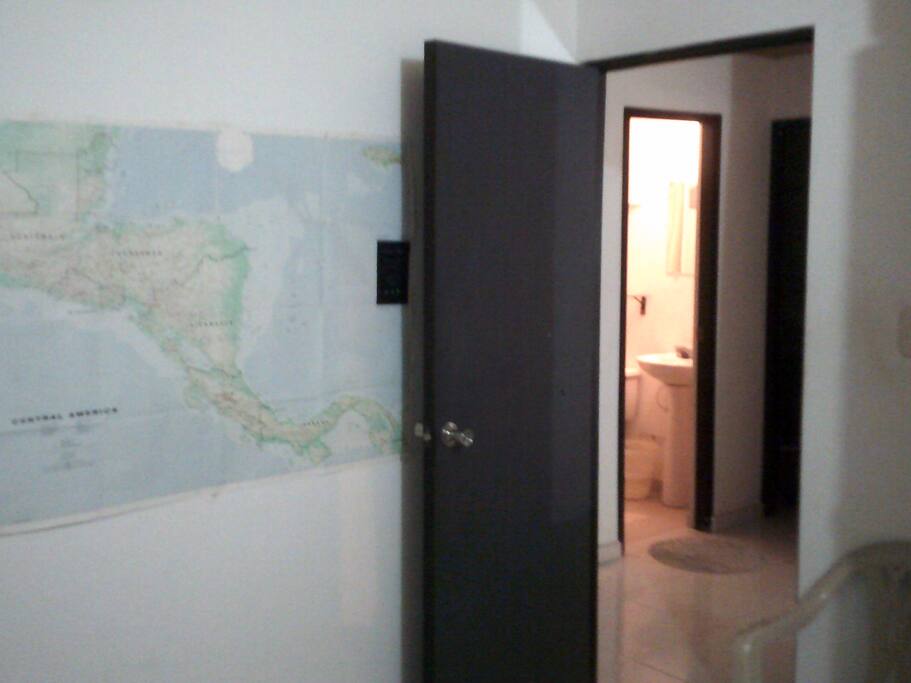 bedroom with adjacent bathroom