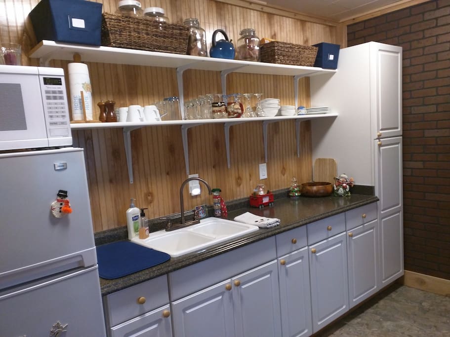 kitchenette area. all the dishes and cooking supplies. Refrigerator, microwave, and hot plate available for food preparation