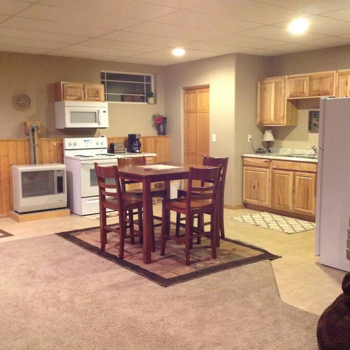 Kitchen area with table and chairs for 4