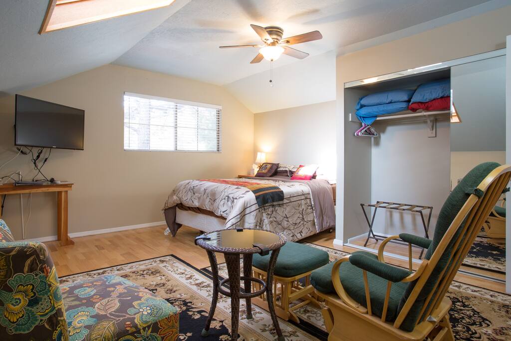Sitting area in bedroom with 40" flat screen TV