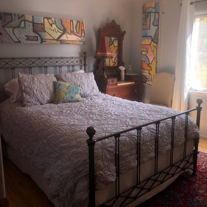Queen size bed, dresser, original art, East window