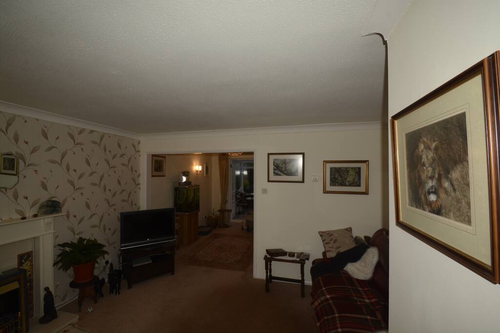 Sitting room leading to dining room and conservatory.