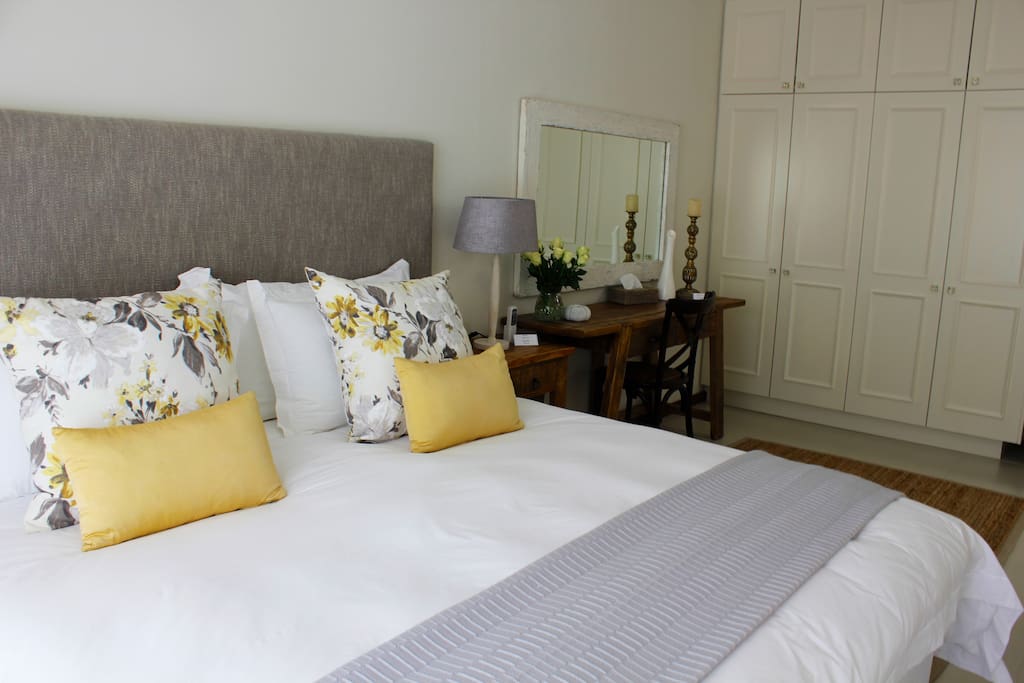 Luxuriously decorated bedroom with crisp white pure cotton linen