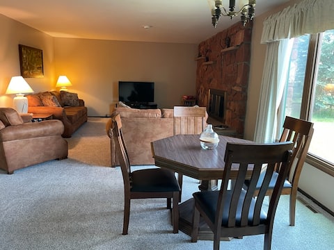 Cheerful home with a fireplace and large kitchen.