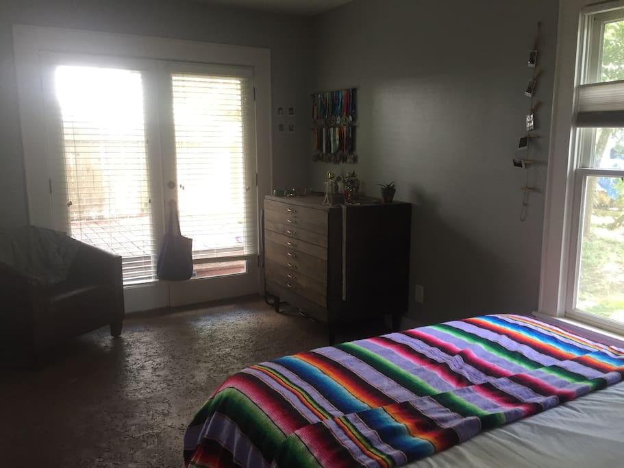 Being bedroom, opens to the back deck, BBQ access and fire pit