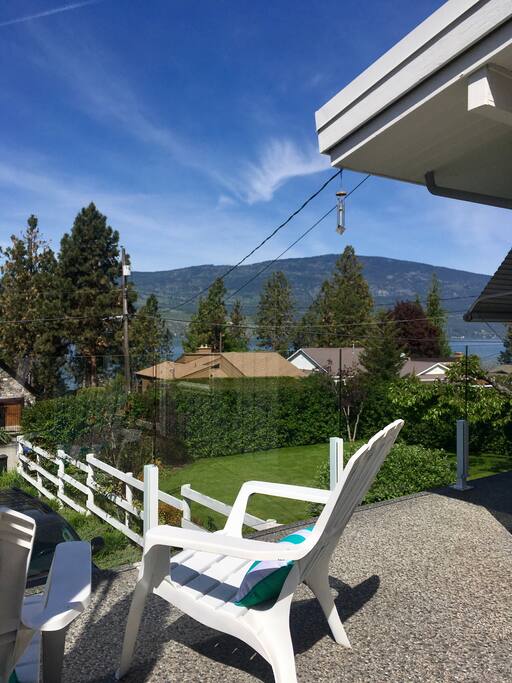 Lake & mountain views from beautiful deck. Dining seating for 6 and huge umbrella not pictured.