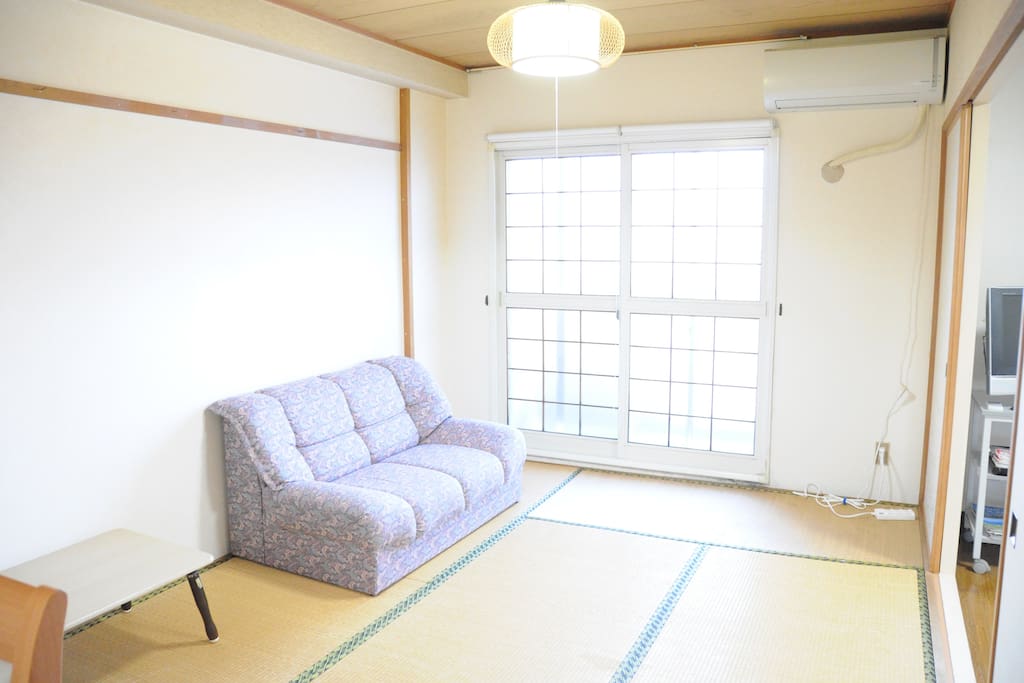 Bedroom with a comfortable couch.