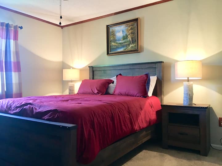 Master bedroom with a full view of lake from window