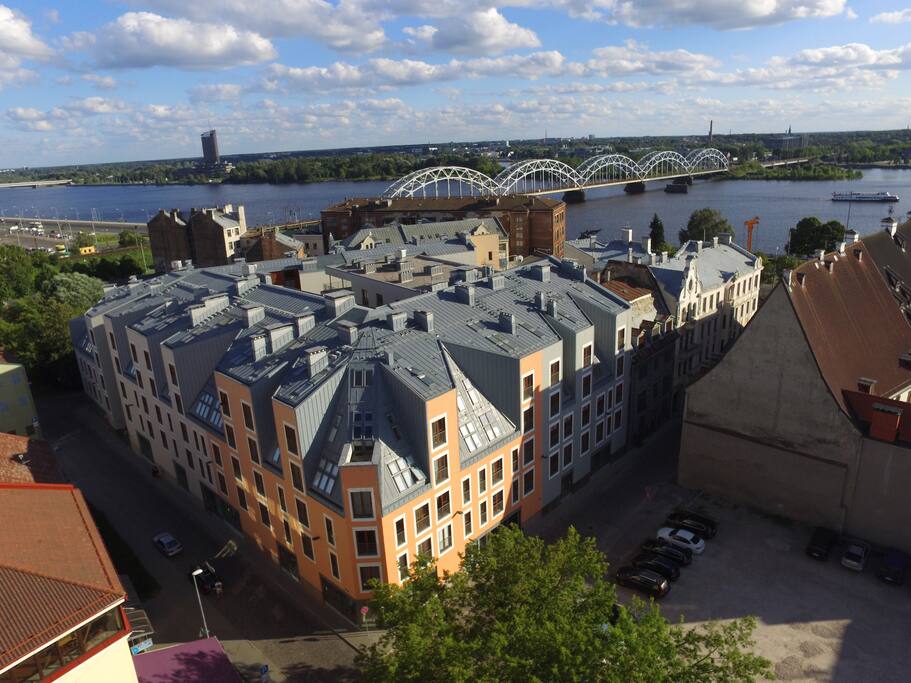 Bird view to the condominium where the Old Riga Julia apartments are situated, as well as Daugava river Embankement and Railway bridge