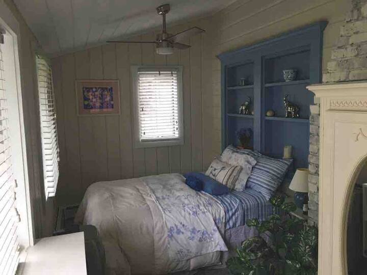 Front  bedroom with full bed ceiling fan and air conditioning 