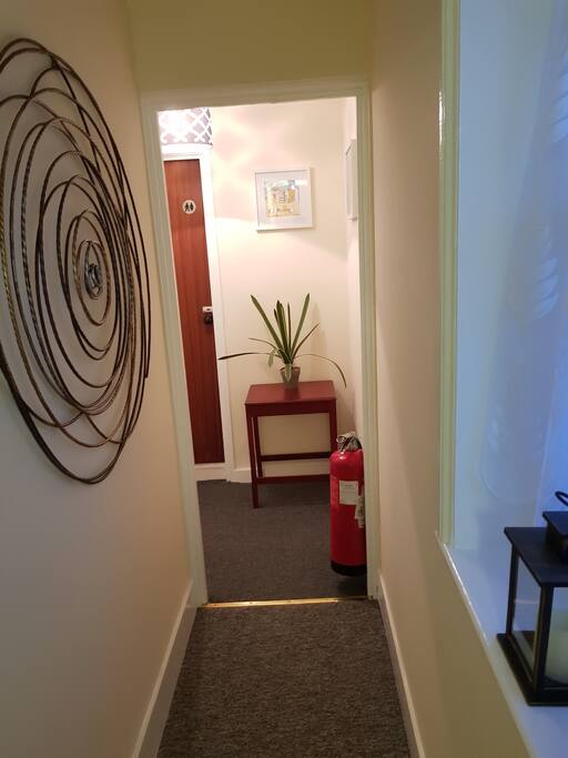 Hallway to bedroom and shower/w.c