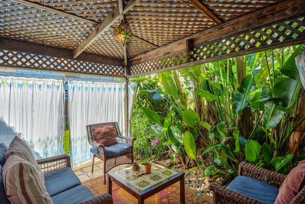 Tropical Cabana Room with surrounding curtains for added privacy.