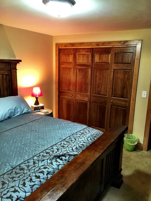King sized bed and pillows with luxury bedding.